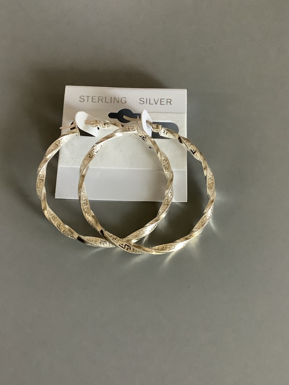 Sterling Silver Textured Hoop Earrings  
Lightweight.